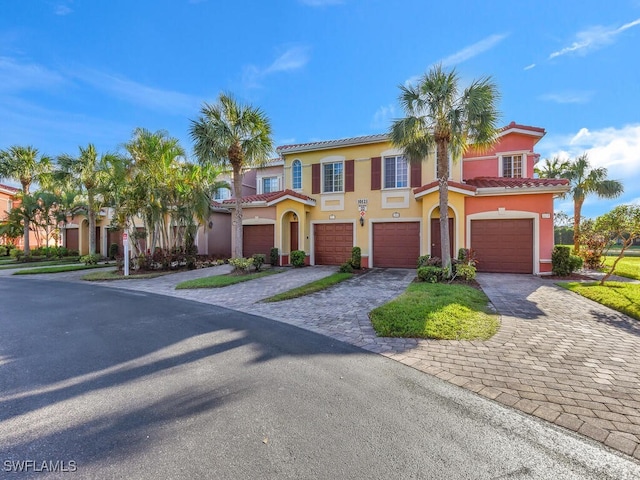 mediterranean / spanish-style house featuring a garage