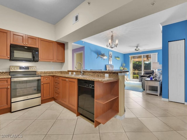 kitchen with sink, kitchen peninsula, light tile patterned floors, black appliances, and ceiling fan with notable chandelier