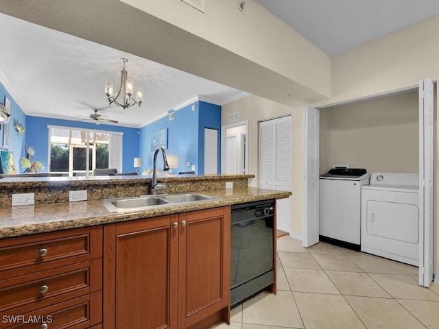 kitchen featuring dishwasher, sink, crown molding, light tile patterned floors, and washer and dryer