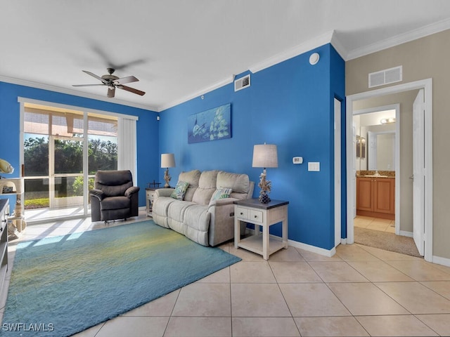 living room with ceiling fan, light tile patterned flooring, and ornamental molding