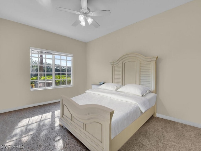 bedroom with ceiling fan and light colored carpet