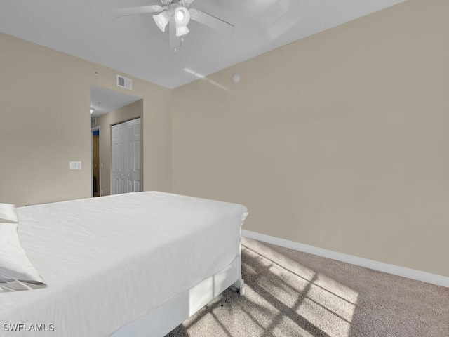 bedroom featuring carpet floors, a closet, and ceiling fan