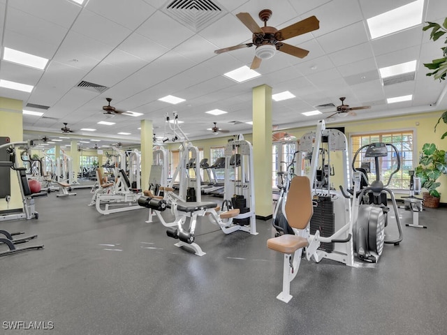 gym featuring a paneled ceiling