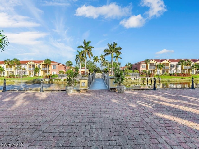 view of home's community with a water view