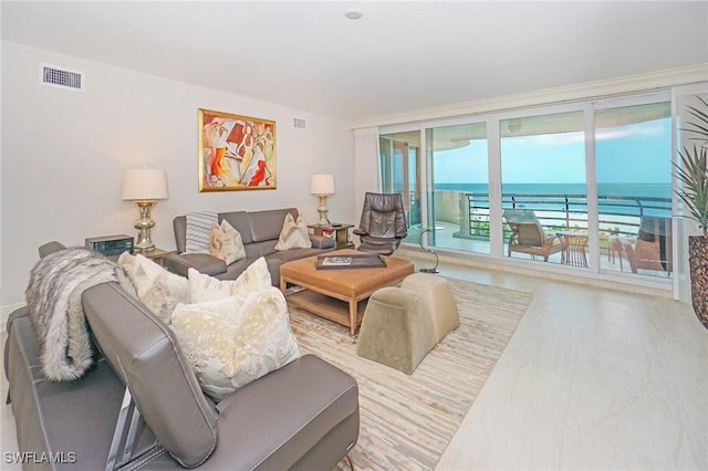 living room featuring a water view