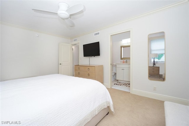 carpeted bedroom with ceiling fan, ornamental molding, and connected bathroom