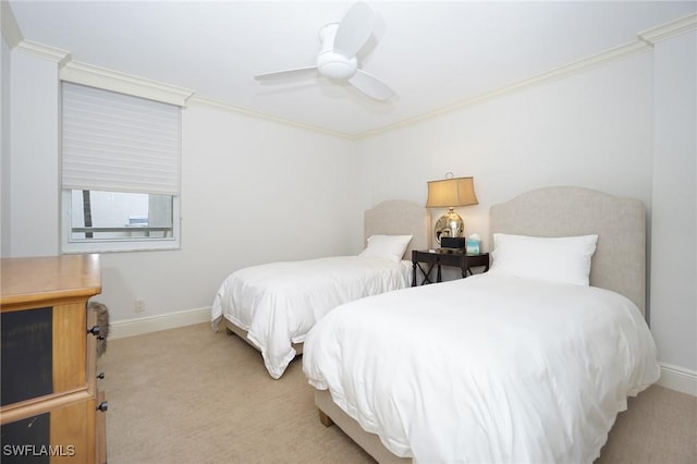 carpeted bedroom with ceiling fan and crown molding