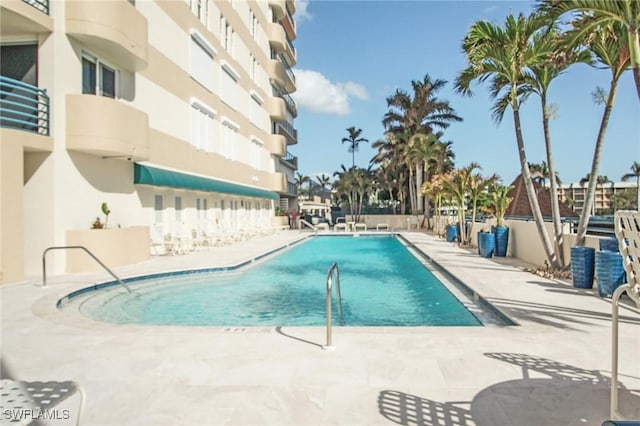 view of pool featuring a patio