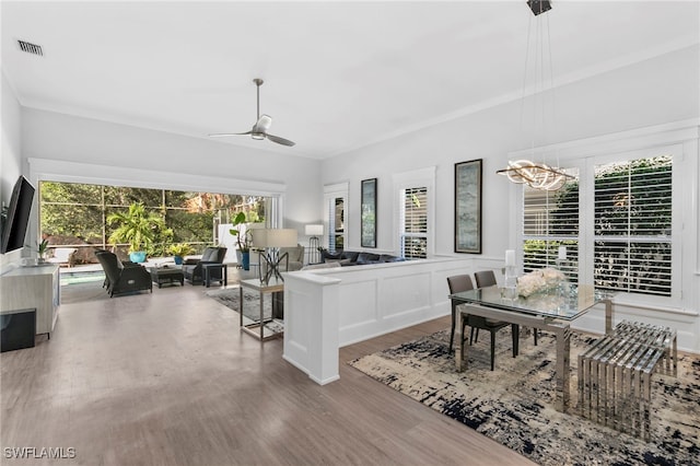 living room with ceiling fan, a wealth of natural light, and hardwood / wood-style flooring