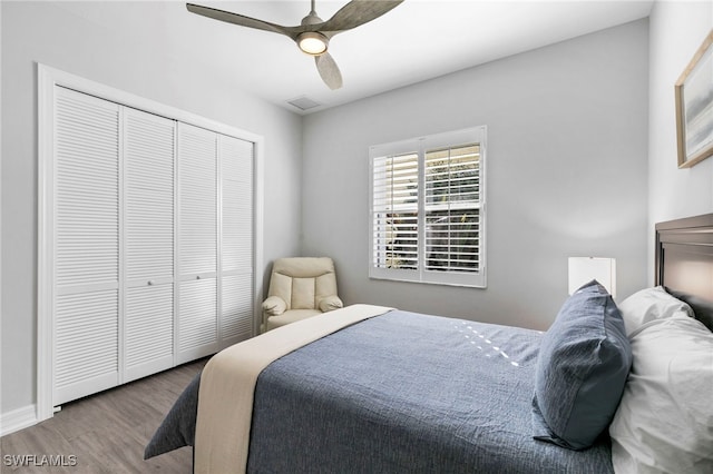 bedroom featuring a closet, ceiling fan, and wood-type flooring