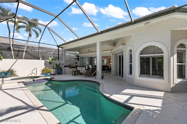 view of pool with an in ground hot tub, a lanai, area for grilling, ceiling fan, and a patio area