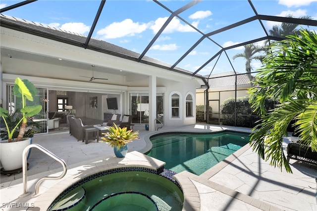 view of swimming pool with a lanai, an in ground hot tub, a patio area, and an outdoor hangout area