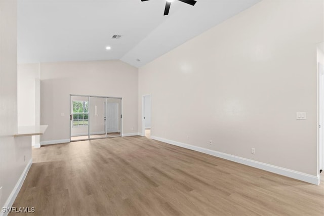 unfurnished living room with ceiling fan, high vaulted ceiling, and light wood-type flooring