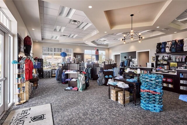 misc room featuring a chandelier, carpet floors, and coffered ceiling