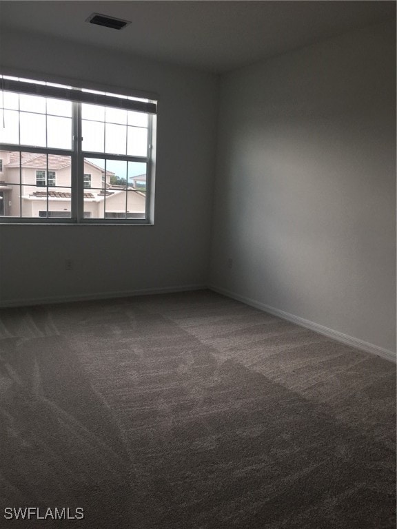 unfurnished room with carpet floors