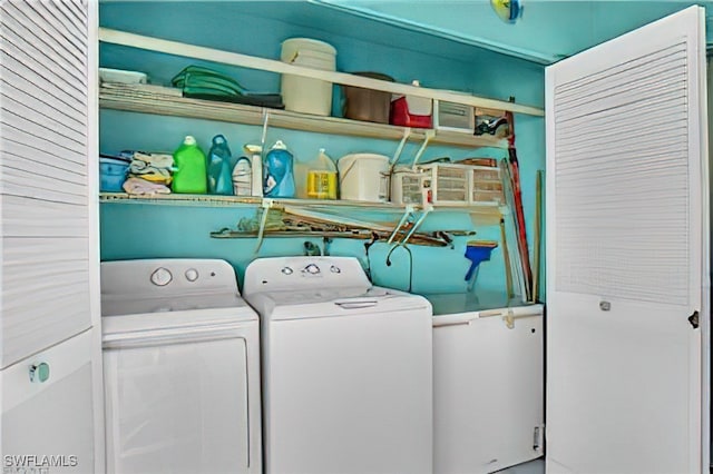 laundry room featuring washing machine and clothes dryer