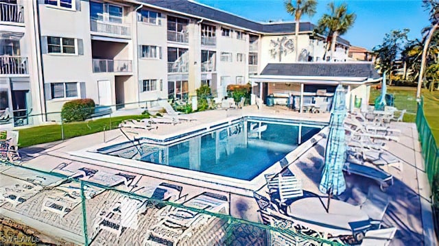 view of swimming pool featuring a patio area