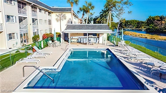 view of swimming pool with a patio