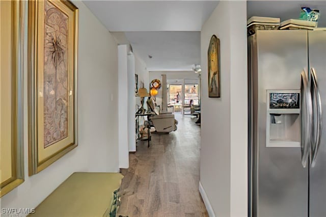 hallway with wood-type flooring