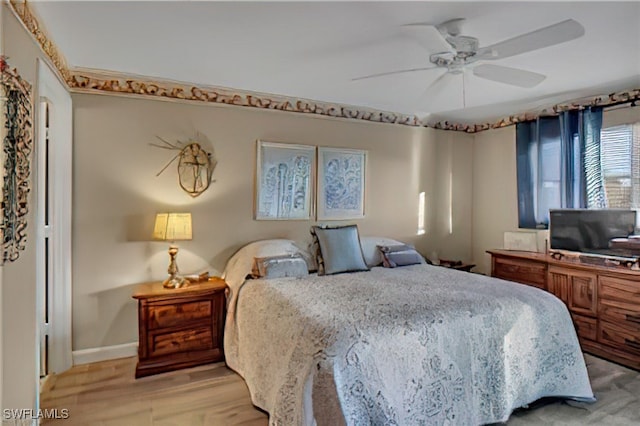 bedroom with light wood-type flooring and ceiling fan