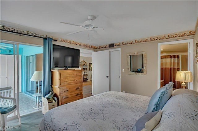 carpeted bedroom featuring ceiling fan and a closet