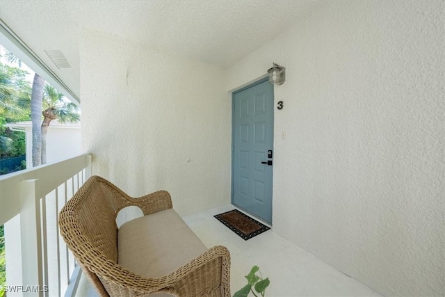 doorway to property with a balcony