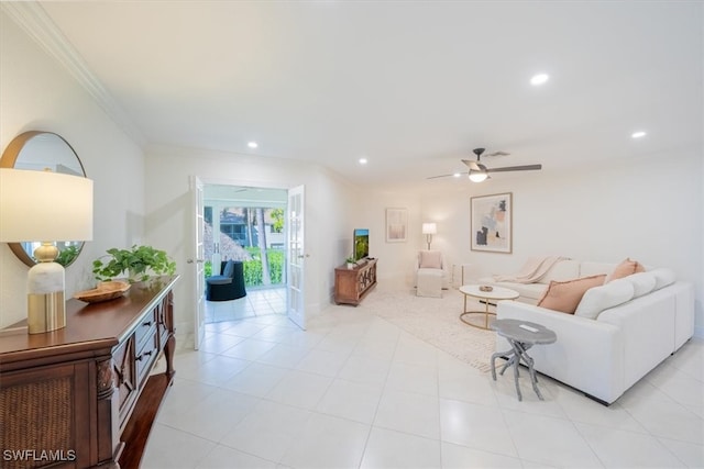 living room featuring crown molding, baseboards, a ceiling fan, and recessed lighting