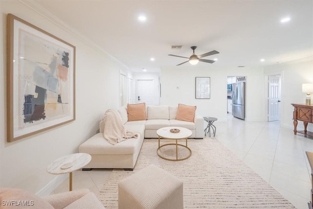 living area featuring light tile patterned floors, recessed lighting, visible vents, and ornamental molding