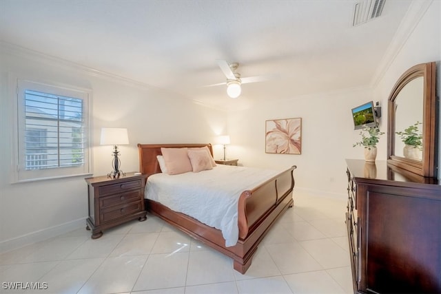 bedroom featuring light tile patterned floors, ornamental molding, visible vents, and baseboards