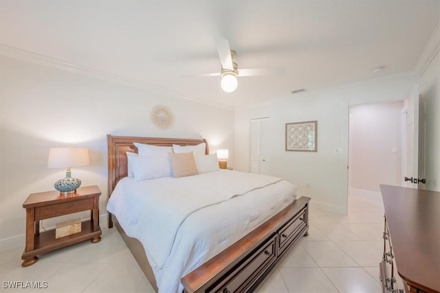 bedroom featuring light tile patterned floors, baseboards, ornamental molding, and a ceiling fan