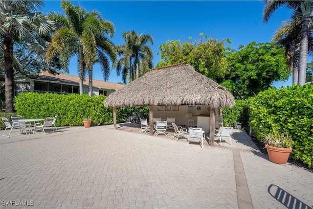 view of property's community with a patio area and a gazebo