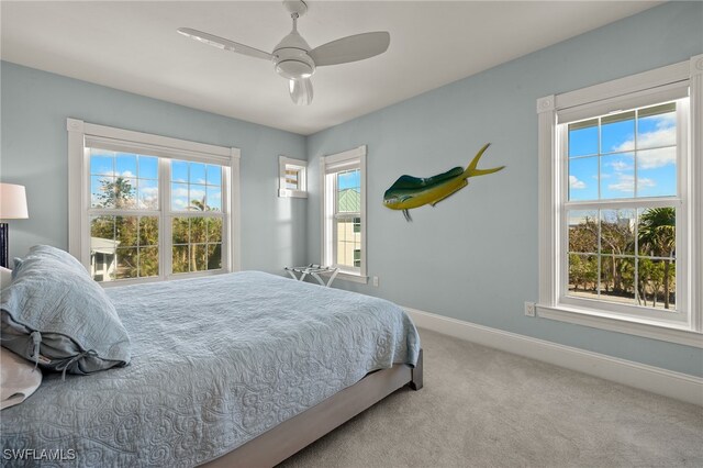 411 Bella Vista Way E, Sanibel, FL 33957 - carpeted bedroom with baseboards and ceiling fan