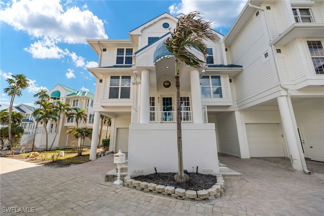411 Bella Vista Way E, Sanibel, FL 33957 - view of front of home with an attached garage and decorative driveway