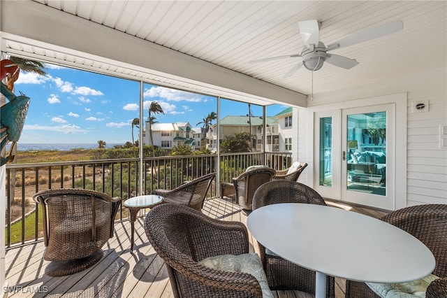 sunroom / solarium with a wealth of natural light and ceiling fan