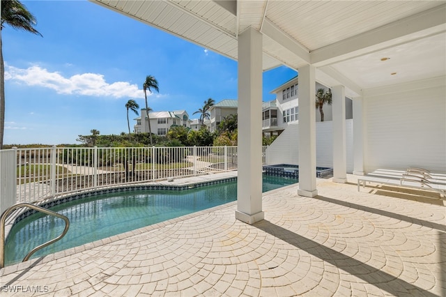 view of swimming pool with a patio