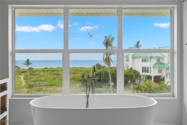 411 Bella Vista Way E, Sanibel, FL 33957 - unfurnished dining area with a water view and plenty of natural light