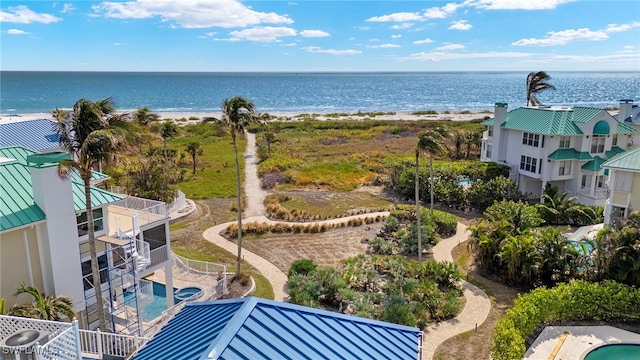 bird's eye view featuring a beach view and a water view