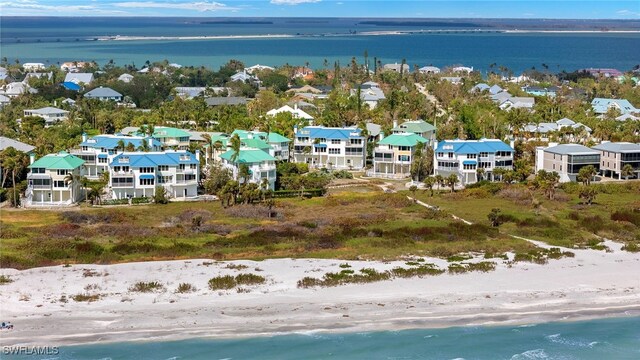 411 Bella Vista Way E, Sanibel, FL 33957 - aerial perspective of suburban area with extended coastline