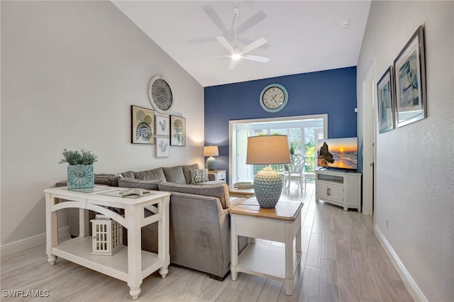 living room with vaulted ceiling, light hardwood / wood-style flooring, and ceiling fan