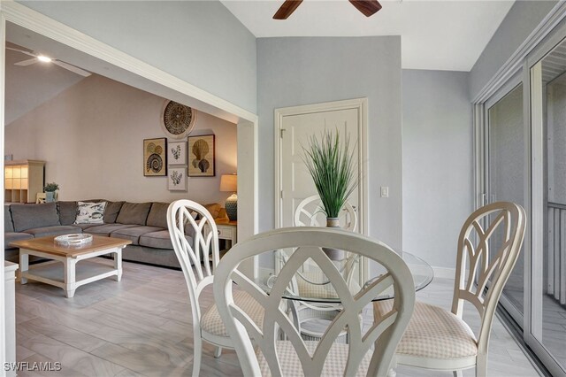 dining room with vaulted ceiling and ceiling fan