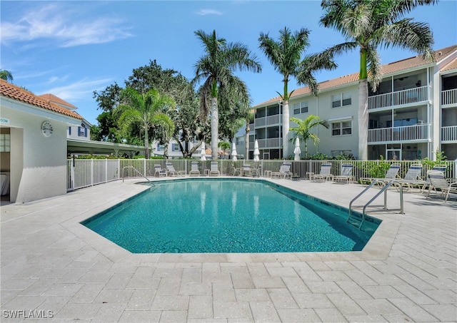 view of swimming pool with a patio area