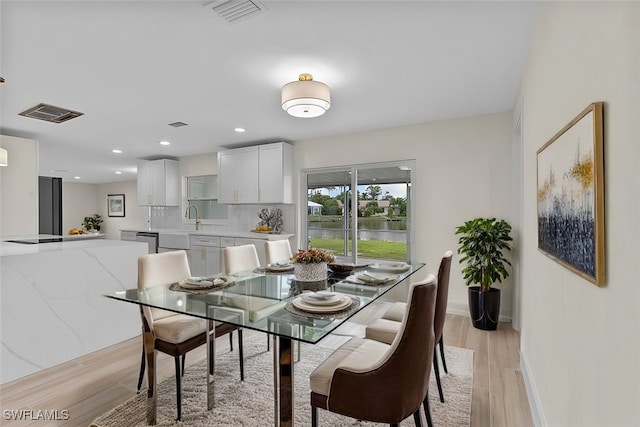 dining room with light hardwood / wood-style floors