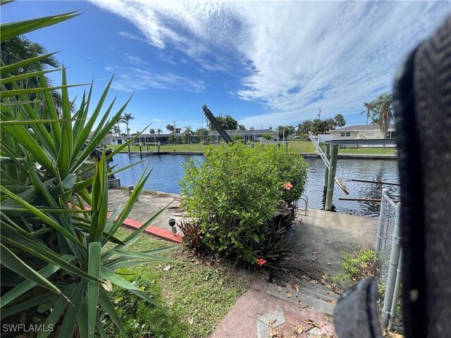 property view of water featuring a boat dock