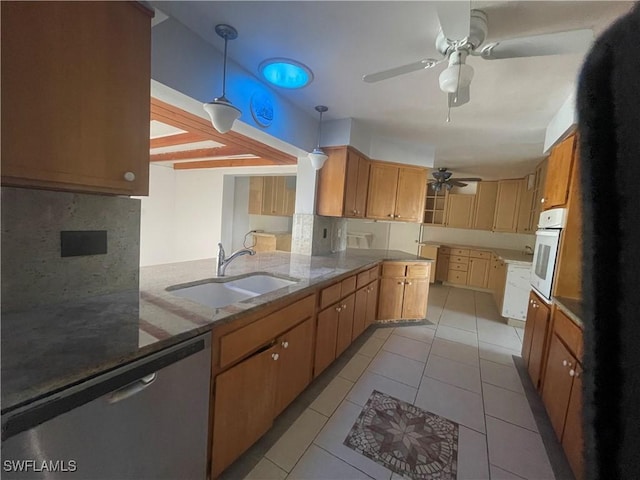 kitchen with sink, white oven, decorative light fixtures, stainless steel dishwasher, and kitchen peninsula