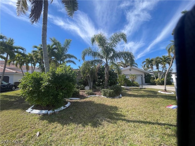 view of yard with a garage