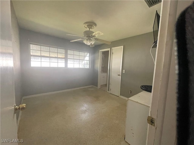 interior space featuring ceiling fan