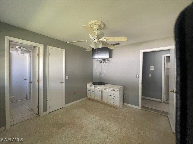 bathroom with tile patterned flooring and ceiling fan