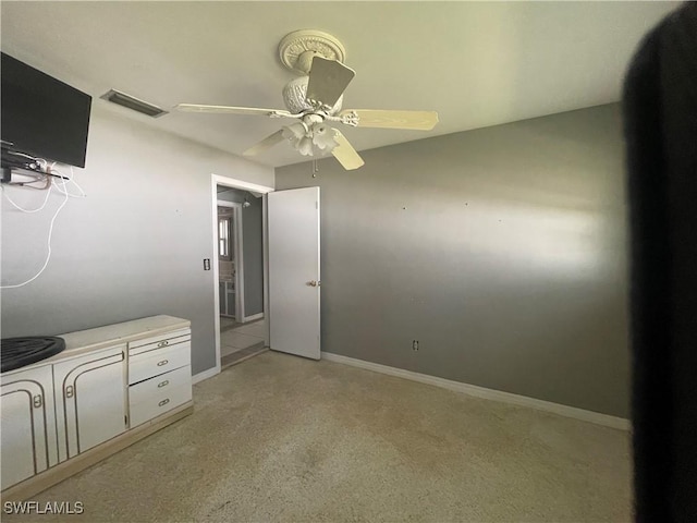 unfurnished bedroom featuring ceiling fan