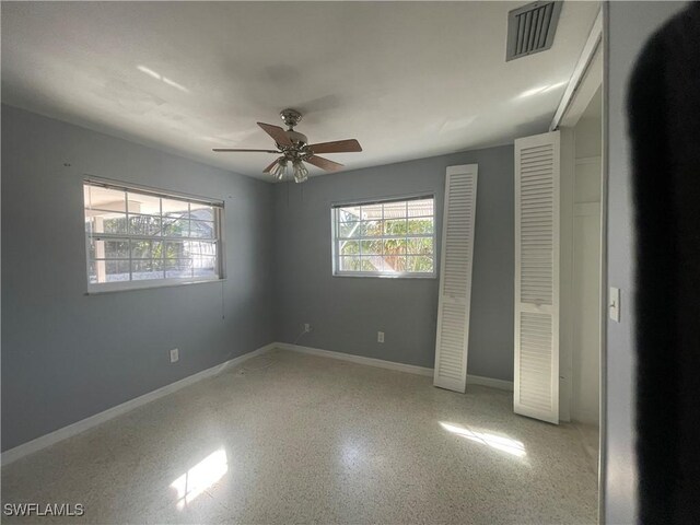 unfurnished bedroom featuring ceiling fan