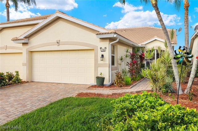 mediterranean / spanish-style home featuring a garage